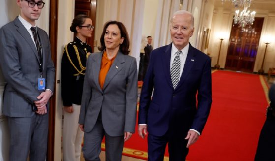 President Joe Biden and Vice President Kamala Harris, pictured walking a White House hallway in an Oct. 30 file photo.