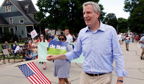 Democratic presidential candidate New York Mayor Bill de Blasio walks in the Fourth of July parade in Independence, Iowa, on July 4, 2019.