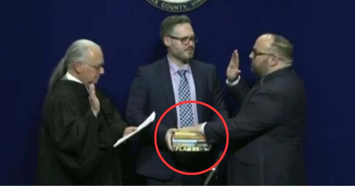 Karl Frisch, a member of the Fairfax County School Board in Virginia, was sworn in on Wednesday on a stack of books containing pornographic material.