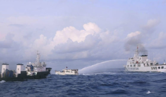 A Chinese Coast Guard ship is shown using water cannons on a Philippine navy-operated supply boat in the disputed South China Sea on Sunday.