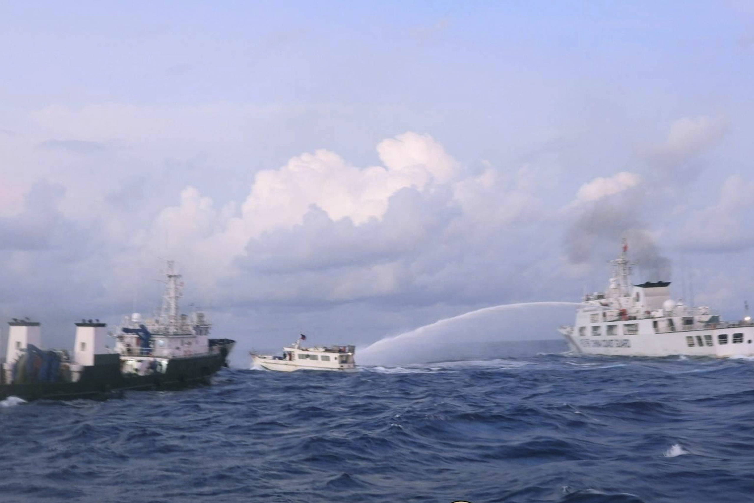 A Chinese Coast Guard ship is shown using water cannons on a Philippine navy-operated supply boat in the disputed South China Sea on Sunday.