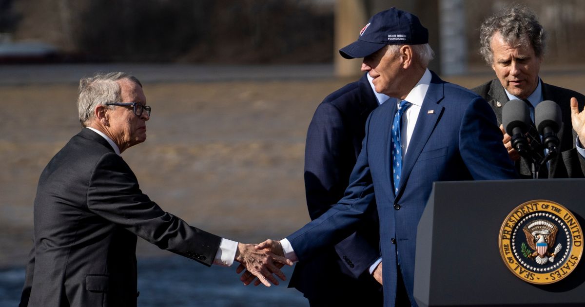President Joe Biden shakes hands with Ohio Gov. Mike DeWine on January 4, 2023 in Covington, Kentucky.