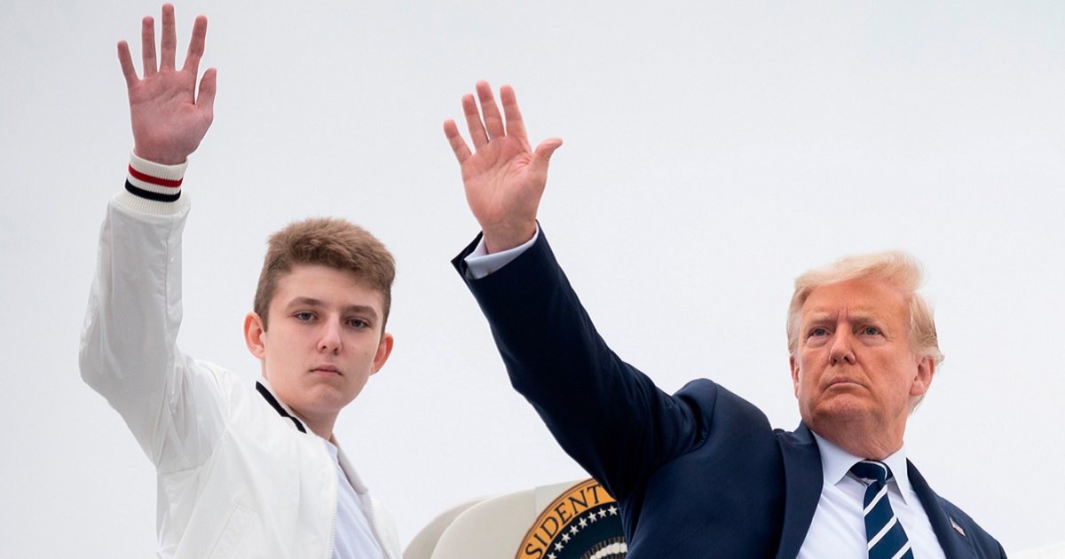 Then-President Donald Trump and his then-14-year-old son, Barron, wave as they board Air Force One at Morristown Municipal Airport in Morristown, New Jersey in an August 2020 file photo.