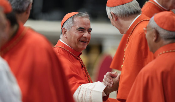Former Cardinal Angelo Becciu attends a consistory inside St. Peter's Basilica, at the Vatican, on Aug. 27, 2022.