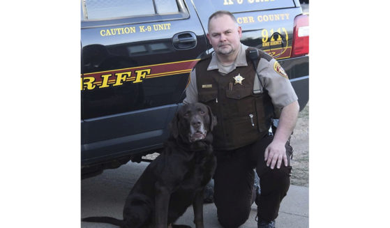 Mercer County Sheriff's Deputy Paul Martin is pictured with his retired K9 Goliath. Martin was killed in a crash on Dec. 6.