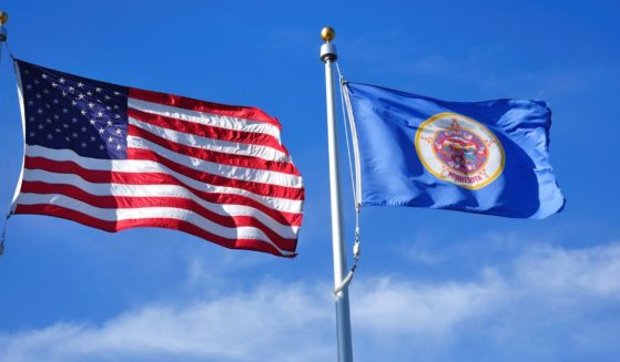 The above stock image is of the U.S. flag and the Minnesota flag.