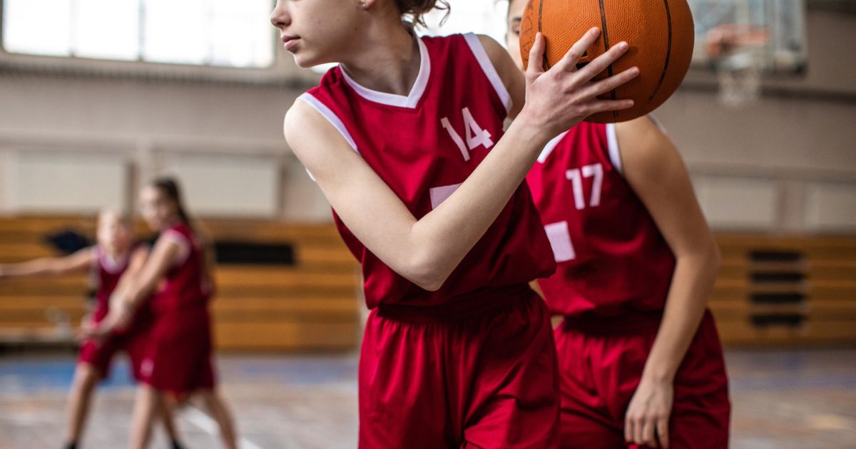 This stock image shows girls playing basketball.