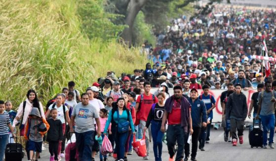 A caravan of migrants walks toward the border with the U.S. in Tapachula, Chiapas, Mexico, on Sunday.