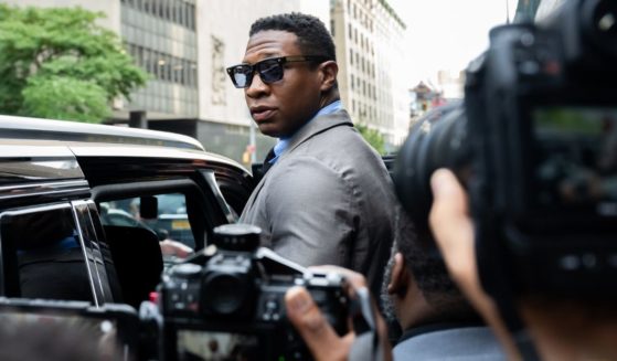Jonathan Majors, looks backs at media while leaving Manhattan Criminal court after his pre trial hearing on August 3, 2023 in New York City.