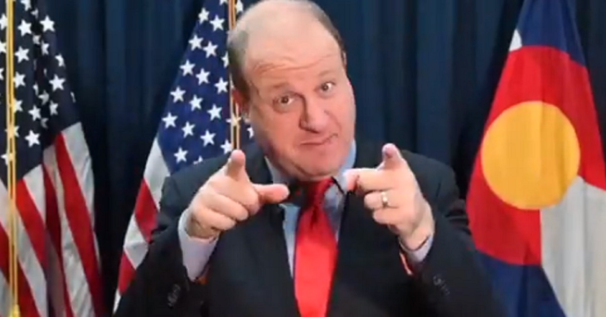 Colorado Gov. Jared Polis is pictured in a still from a video on the governor's office Spanish-language account.