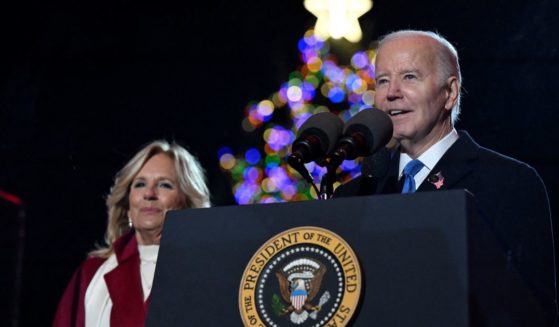 President Joe Biden speaks as First Lady Jill Biden looks on during the National Christmas tree lighting ceremony on the Ellipse of the White House in Washington, D.C., on Thursday.