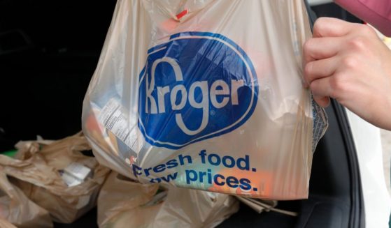 A customer removes her purchases at a Kroger grocery store in Flowood, Mississippi.