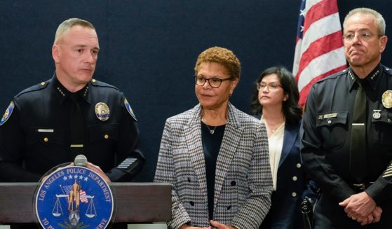 Beverly Hills Police Chief Mark Stainbrook, left, Los Angeles Mayor Karen Bass and Los Angeles Police Chief Michel Moore announce the arrest Saturday of a suspect in three recent killings of homeless men in Los Angeles.