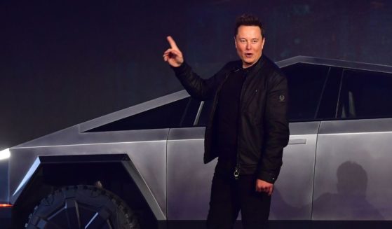 Tesla co-founder and CEO Elon Musk gestures while introducing the newly unveiled all-electric battery-powered Tesla Cybertruck at Tesla Design Center in Hawthorne, California on November 21, 2019.