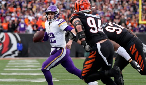 Minnesota Vikings quarterback Nick Mullens scrambles with the ball in the fourth quarter of Saturday's game against the Cincinnati Bengals at Paycor Stadium in Cincinnati. Mullens gave up a costly interception earlier in the game.