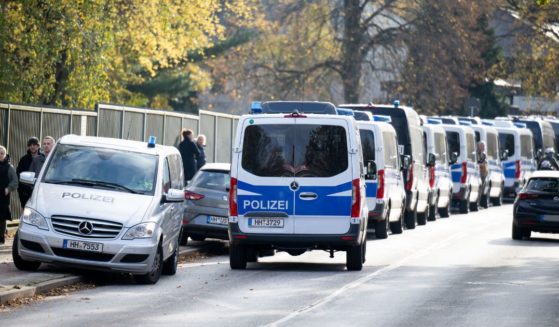 Police cars are seen outside a school in the Blankenese district of Hamburg, northern Germany, on November 8, 2023.