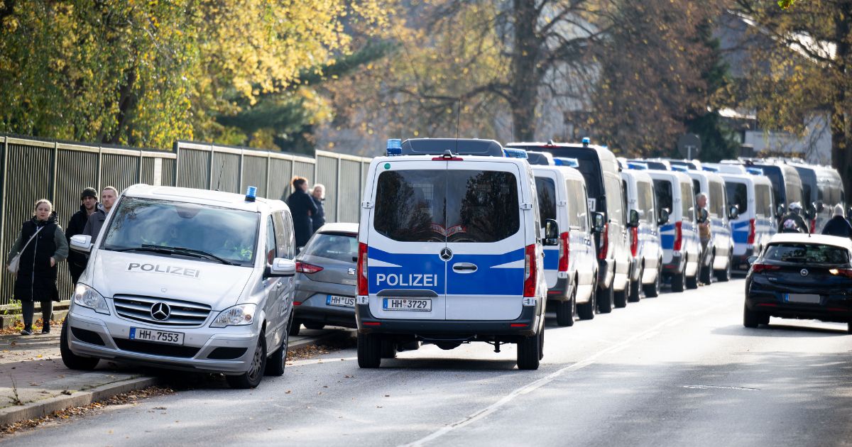Police cars are seen outside a school in the Blankenese district of Hamburg, northern Germany, on November 8, 2023.