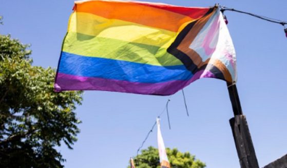 A "progress pride" flag flies is pictured in an image from The Denver Post account on X.