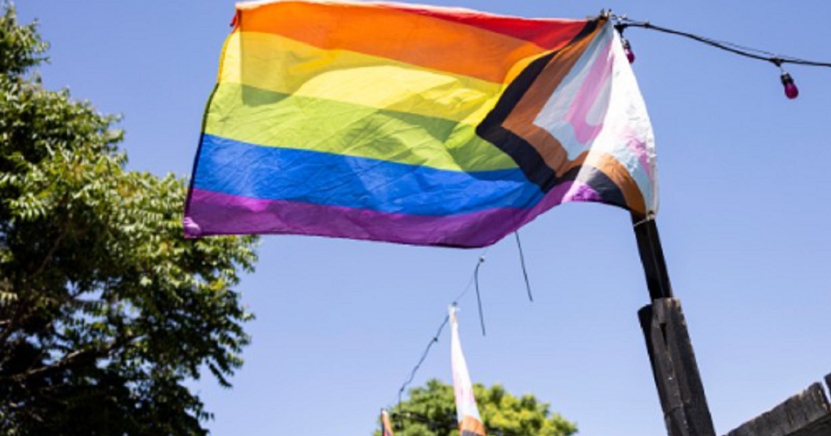 A "progress pride" flag flies is pictured in an image from The Denver Post account on X.