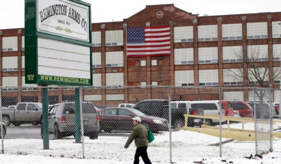 A man walks past the Remington Arms Company on Jan. 17, 2013, in Ilion, New York.