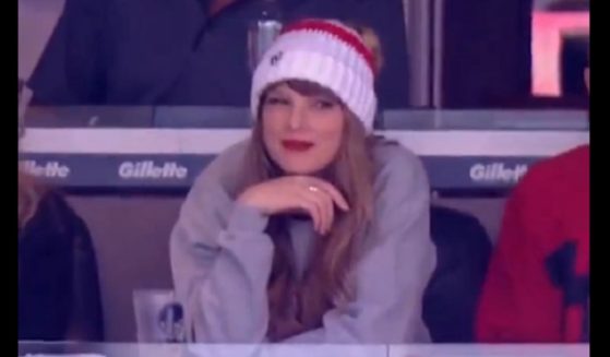 Pop star Taylor Swift gives a rueful grin amid booing Sunday at Gillette Stadium in Foxborough, Massachusetts.
