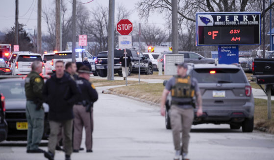 Police respond to Perry High School in Perry, Iowa, on Thursday.