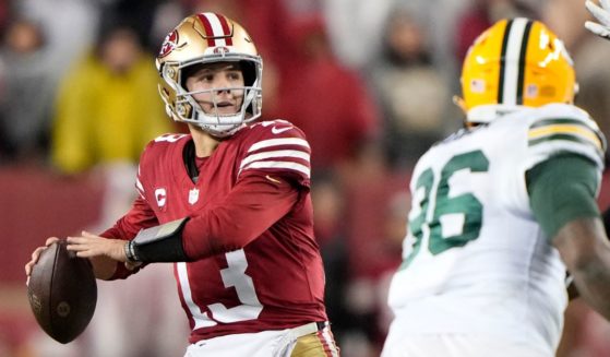 San Francisco 49ers quarterback Brock Purdy looks to pass during the second half against the Green Bay Packers in the NFC Divisional Playoffs in Santa Clara, California, on Saturday.