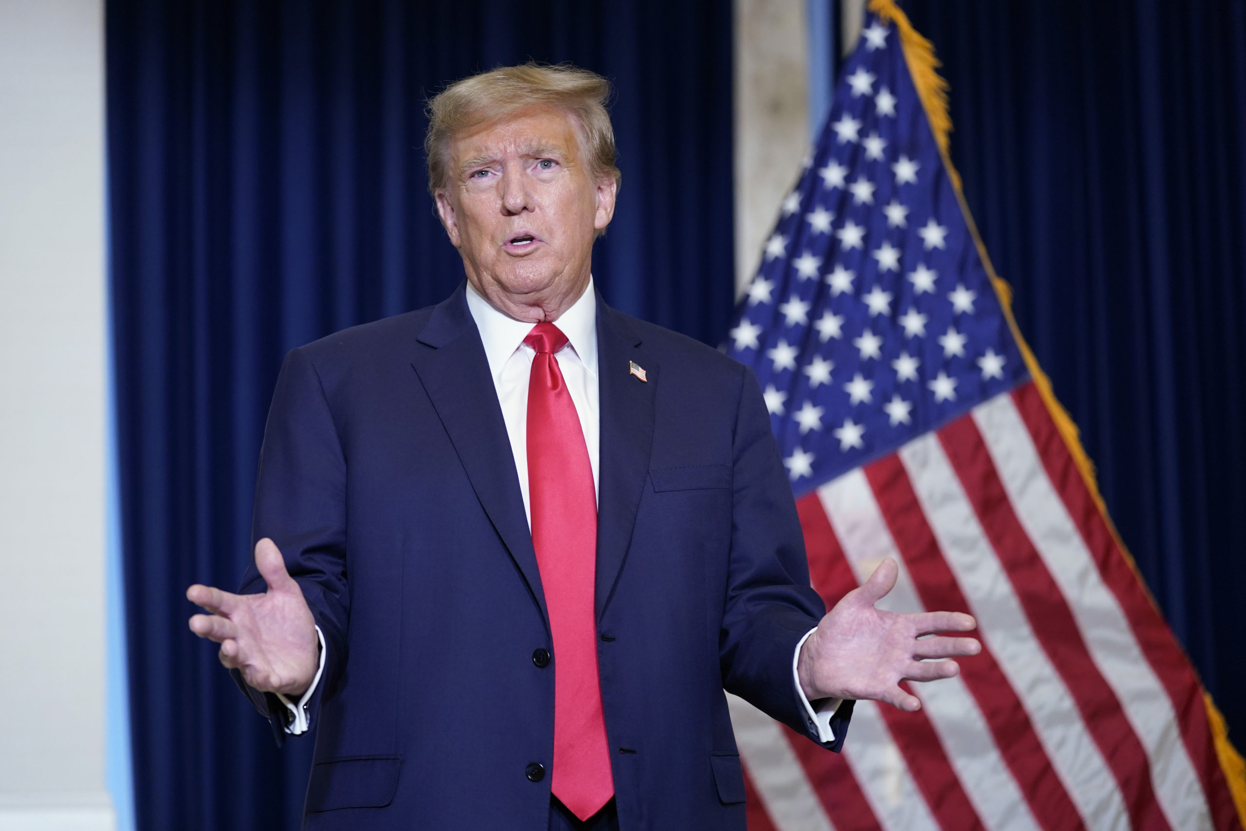 Former President Donald Trump speaks to the media at a Washington hotel Tuesday after attending a hearing before the D.C. Circuit Court of Appeals at the federal courthouse in Washington.