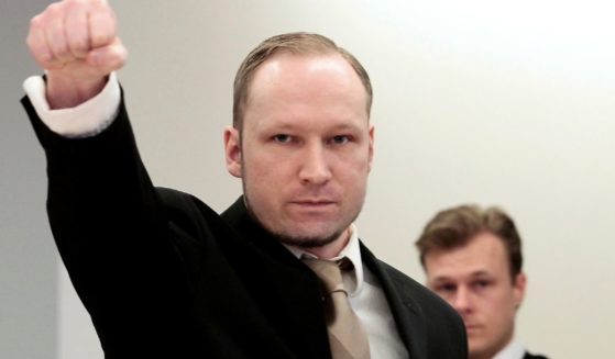 Anders Behring Breivik gestures as he arrives at a courtroom in Oslo, Norway, April 17, 2012.