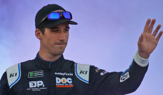 Austin Theriault greets fans in Richmond, Virginia, in a 2019 photo. The NASCAR driver-turned-politician is trying to flip a Main congressional seat red.
