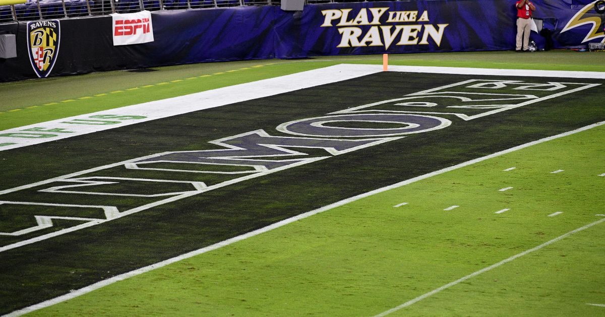the letters "MO" highlighted in the Ravens end zone