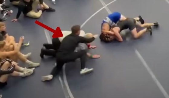 Assistant wrestling coach Russell Brunson of Rocky Mountain High School in Meridian, Idaho, has been banned for coaching for life after he moved onto the mat during his son's match on Jan. 20 and struck the teenage opponent.