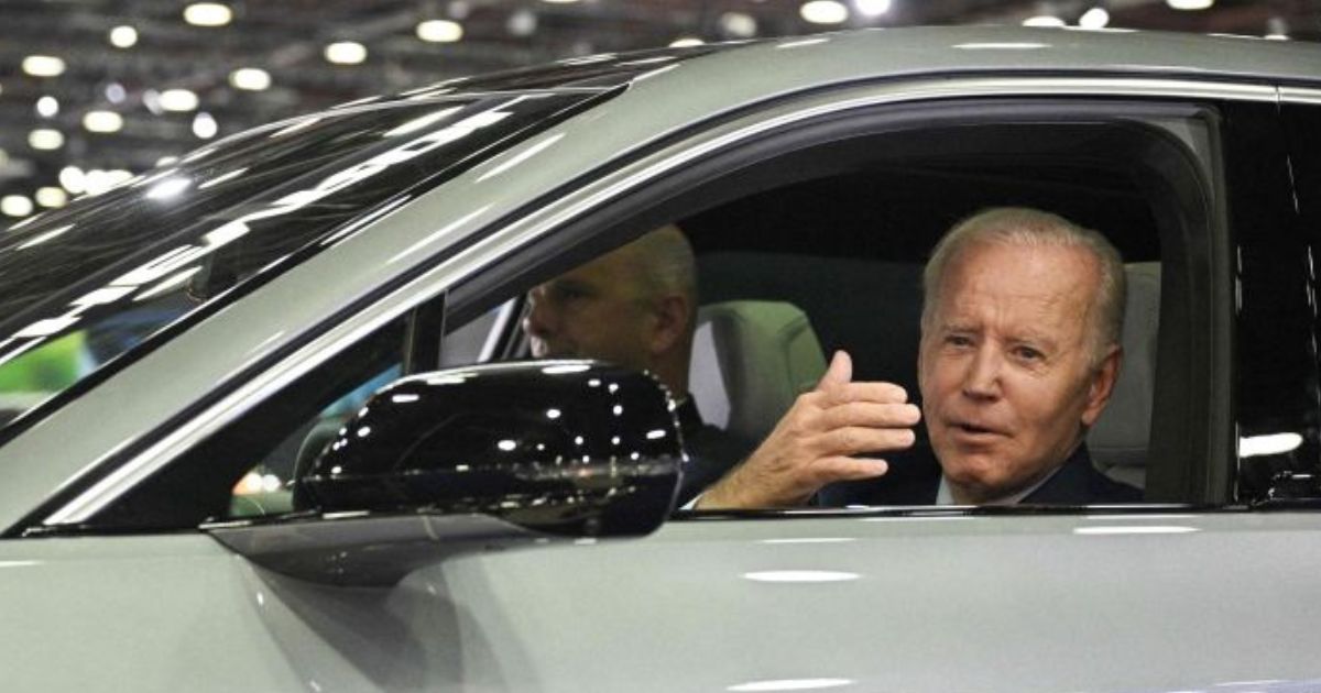 President Joe Biden sits at the wheel of a Cadillac Lyriq electric vehicle as he visits the 2022 North American International Auto Show in Detroit, Michigan, in September 2022.