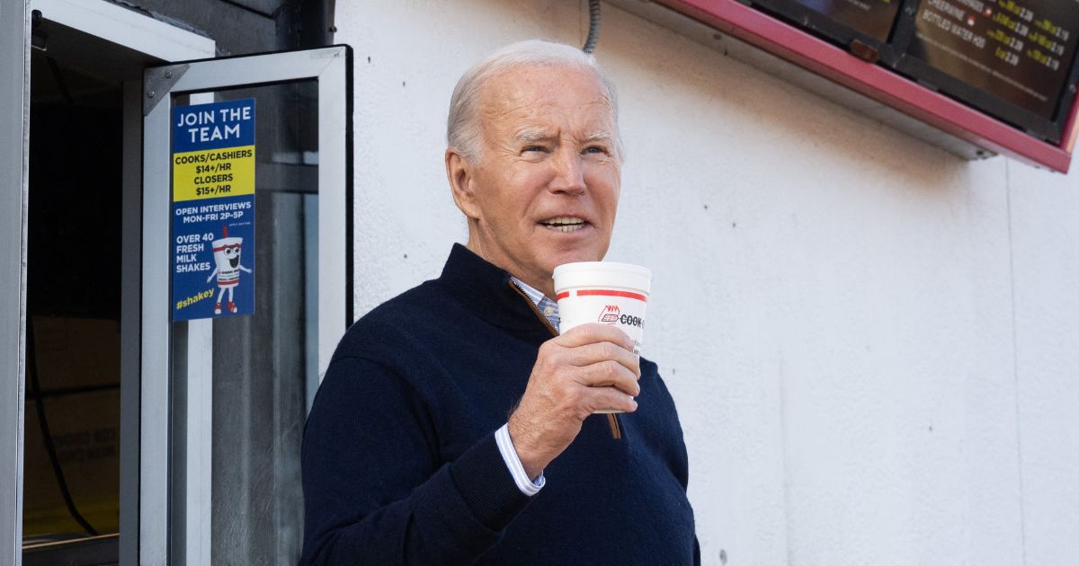 President Joe Biden holds a milkshake during a stop at a Cook Out restaurant in Raleigh, North Carolina, on Thursday.