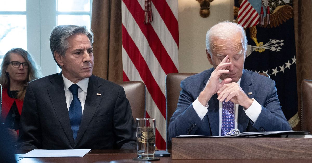 Secretary of State Antony Blinken, left, and President Joe Biden, right, look on during a Cabinet meeting in the Cabinet Room of the White House in Washington, D.C., on Oct. 2.