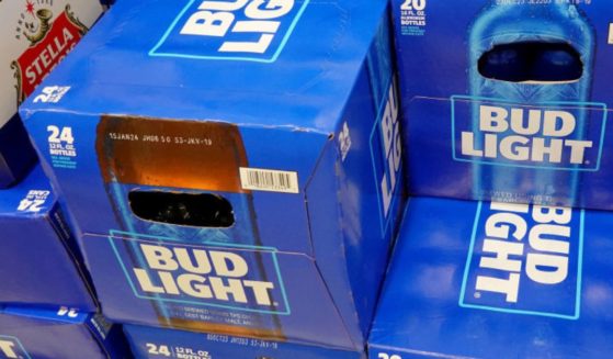 Cases of Bud Light, made by Anheuser-Busch, sit on a store shelf in Miami.