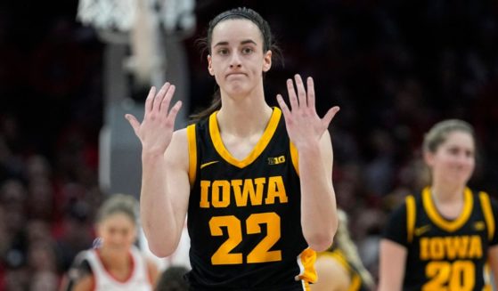 Iowa guard Caitlin Clark gestures in the first half of an NCAA college basketball game against Ohio State, Sunday in Columbus, Ohio.