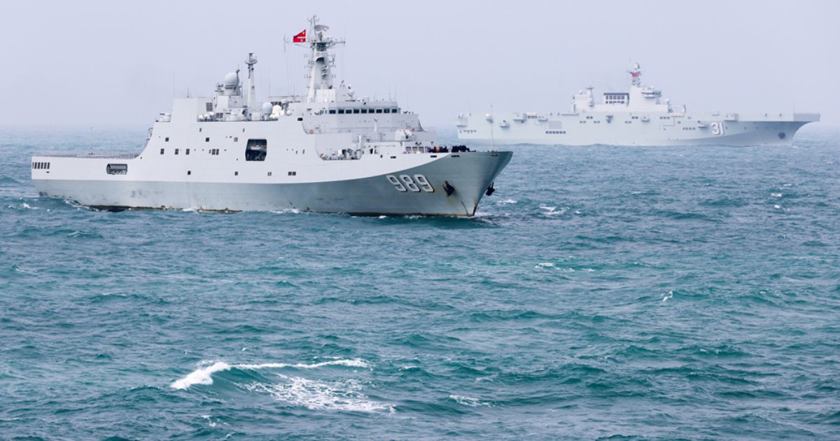The amphibious dock landing ship Changbaishan and the amphibious assault ship Hainan attached to a landing ship flotilla of the Chinese navy steam in formation during a maritime training exercise in late December.
