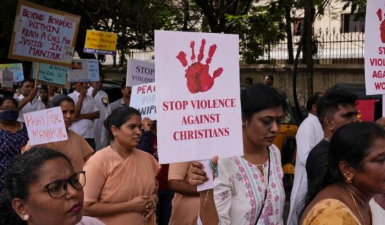 Catholic Christians hold placards and participate in a peace rally against violence in the northeastern Manipur state, in Hyderabad, India, Aug. 25.