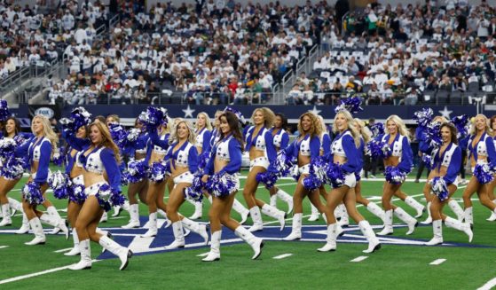 The Dallas Cowboys cheerleaders perform before the team's wild-card playoff game against the Green Bay Packers in Arlington, Texas, on Sunday.