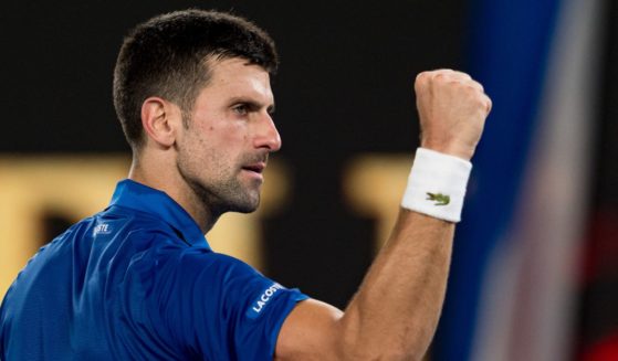Novak Djokovic of Serbia celebrates match point against Tomas Martin Etcheverry of Argentina during the Australian Open at Melbourne Park in Melbourne on Friday.