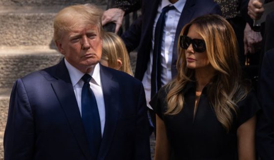Former President Donald Trump and former first lady Melania Trump stand outside of St. Vincent Ferrer Roman Catholic Church after the funeral services of Ivana Trump in New York City on July 20, 2022.