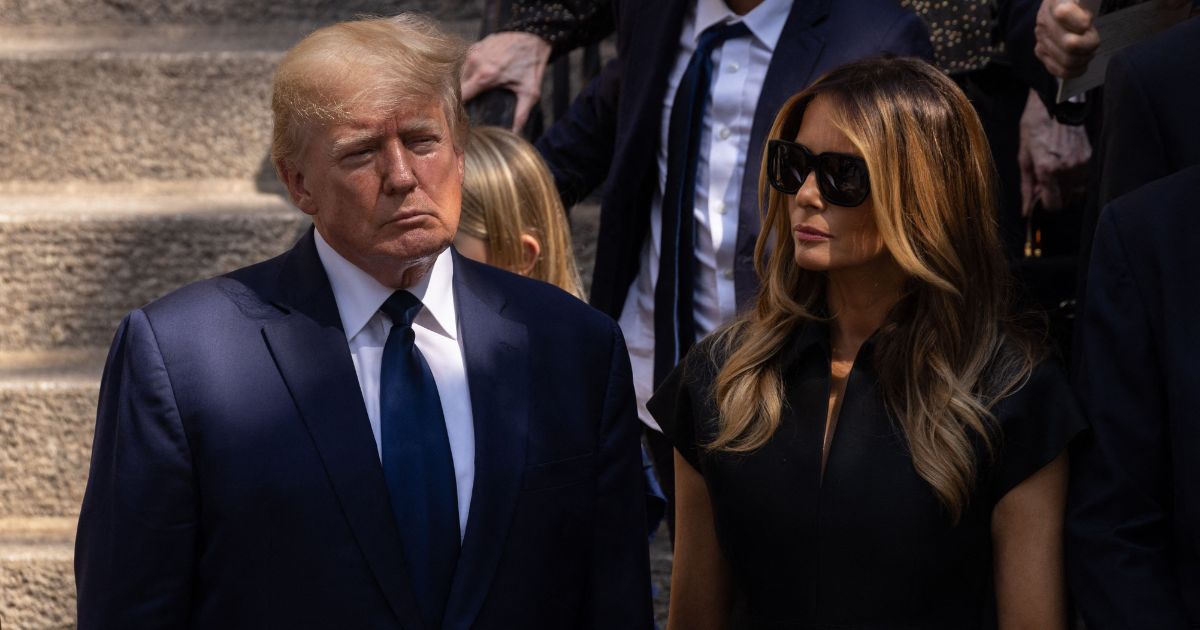 Former President Donald Trump and former first lady Melania Trump stand outside of St. Vincent Ferrer Roman Catholic Church after the funeral services of Ivana Trump in New York City on July 20, 2022.