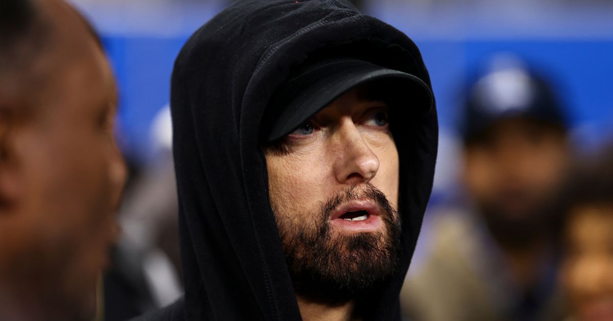 Eminem stands on the field prior to an NFL wild-card playoff football game between the Detroit Lions and the Los Angeles Rams in Detroit, Michigan, on Jan. 14.