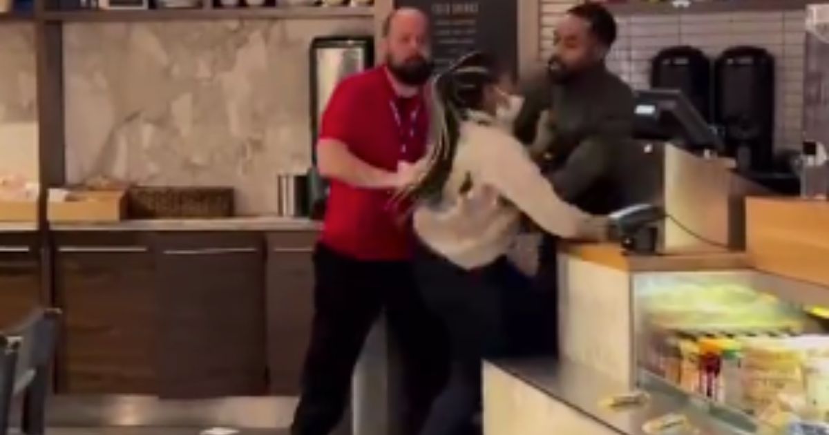Shacoria Elly, center, was fired from Harvest & Grounds in the Atlanta airport after two managers kept her from fighting another employee in a brawl that was caught on video.