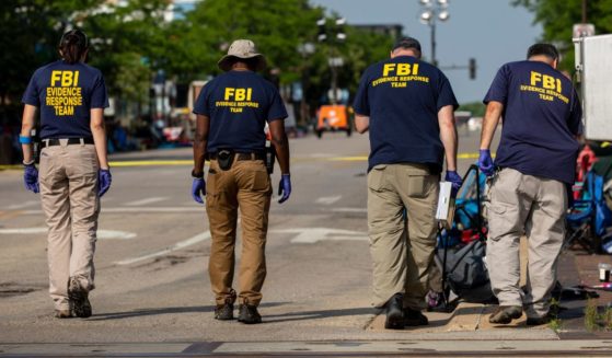 FBI agents work the scene of a shooting at a Fourth of July parade in Highland Park, Illinois, on July 5.