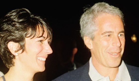 Ghislaine Maxwell and Jeffrey Epstein pose for a picture