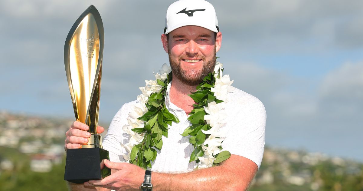 Grayson Murray of the United States poses with the trophy after winning the Sony Open in Honolulu, Hawaii, on Jan. 14.