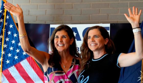 Former South Carolina Gov. Nikki Haley, left, cheers alongside Rep. Nancy Mace, right, during a campaign rally in Summerville, South Carolina, on June 12, 2022.