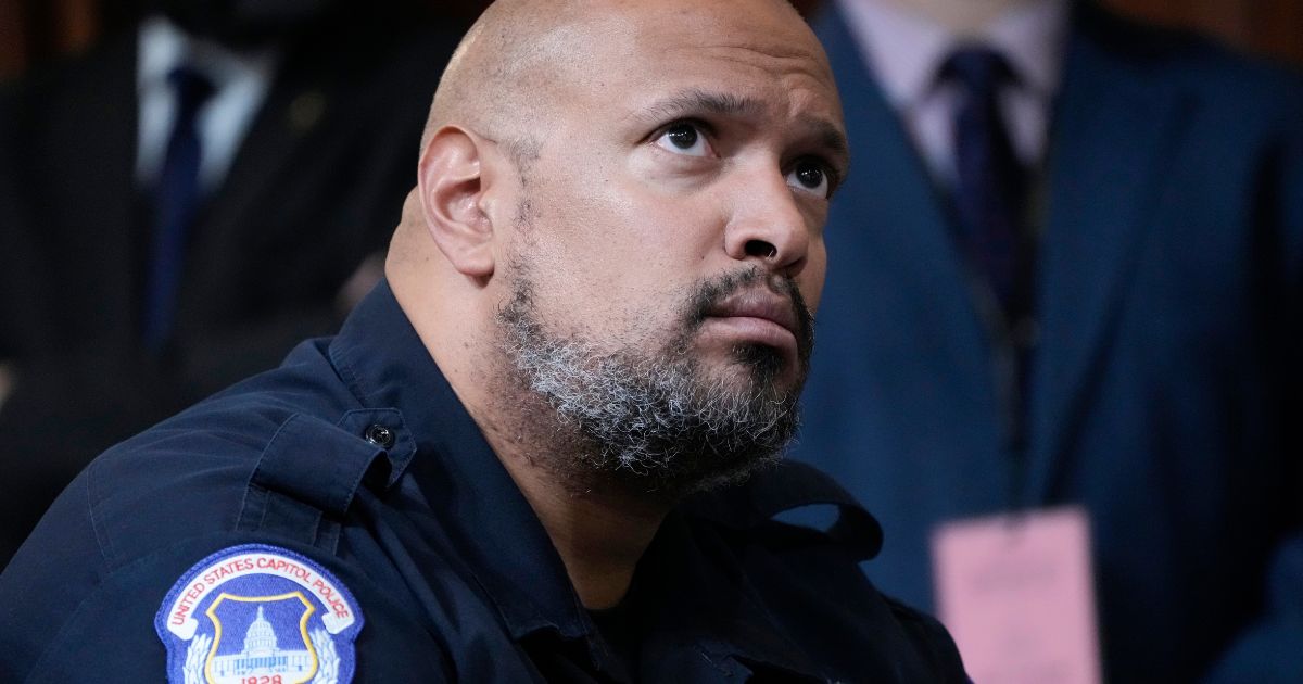 Then-U.S. Capitol Police Sgt. Harry Dunn listens as the House Select Committee investigating the Jan. 6, 2021, incursion at the U.S. Capitol holds its final meeting on Capitol Hill in Washington, Dec. 19, 2022.